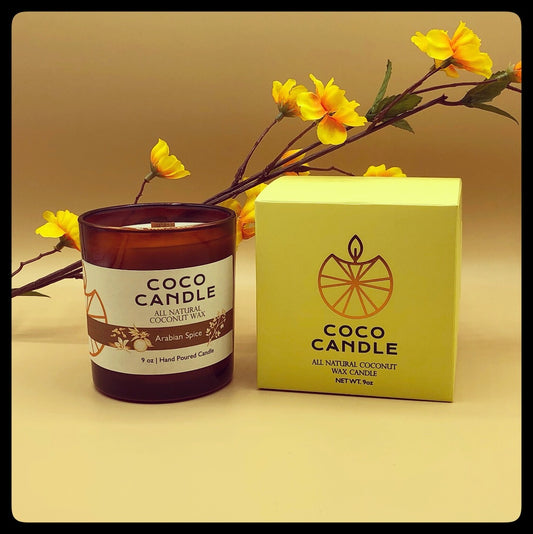Coco Candle | An all-natural coconut wax candle hand poured into a sophisticated amber glass vessel enhanced by the soothing crackle of a wooden wick.  A blend of myrrh and orange, with middles notes of ginger, cinnamon, and cloves.  This fragrance is then rounded out with caraway seed and vanilla giving it a warm, tranquil feeling.